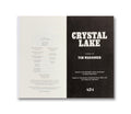 A hardcover copy of Crystal Lake: The Novel, a film book by A24, featuring a gray cover with the title and film imagery.