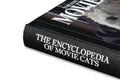 Close-up of the book cover titled "The Encyclopedia of Movie Cats" by A24, featuring illustrated feline characters on a colorful background.