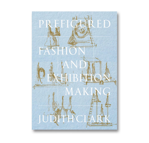 Book cover of 'Prefigured: Fashion and Exhibition Making' by Judith Clark with blue background and gold illustrations.